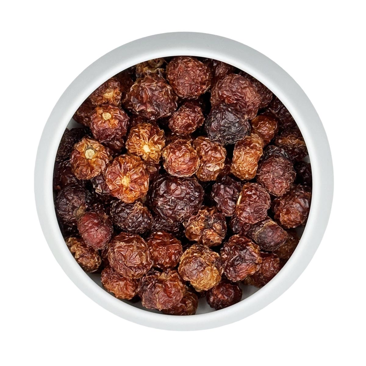 Draufsicht auf eine weiße Schale, gefüllt mit ganzen, getrockneten Wiri-Wiri-Pfefferschoten (Kirschpfeffer) aus Ecuador von Vanissa.