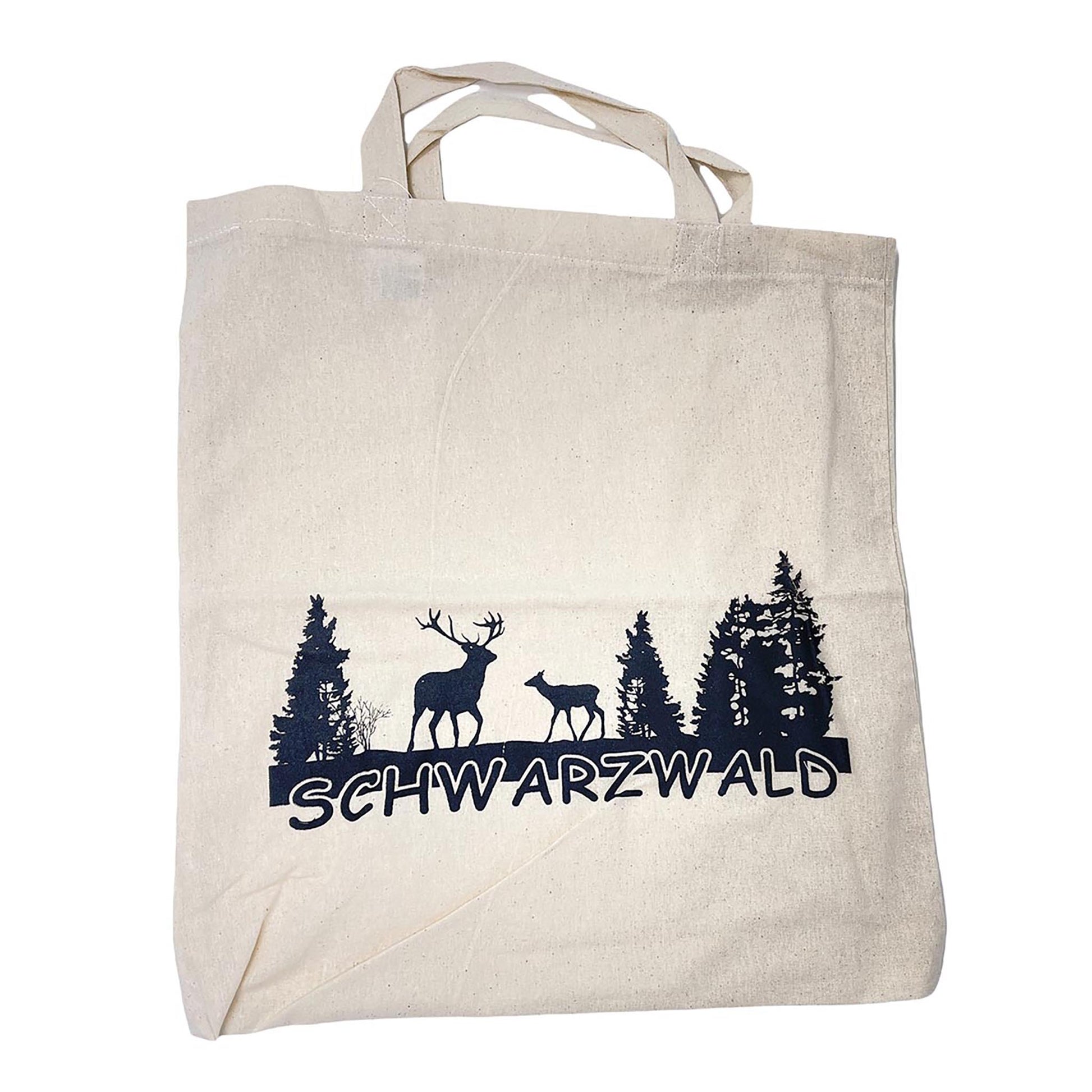 Nachhaltige Baumwolltasche mit schwarzem Schwarzwald-Aufdruck – 38x42 cm großer Stoffbeutel aus 100 % Baumwolle mit Hirsch- und Reh-Silhouetten vor Tannen, freigestellt auf weißem Hintergrund.