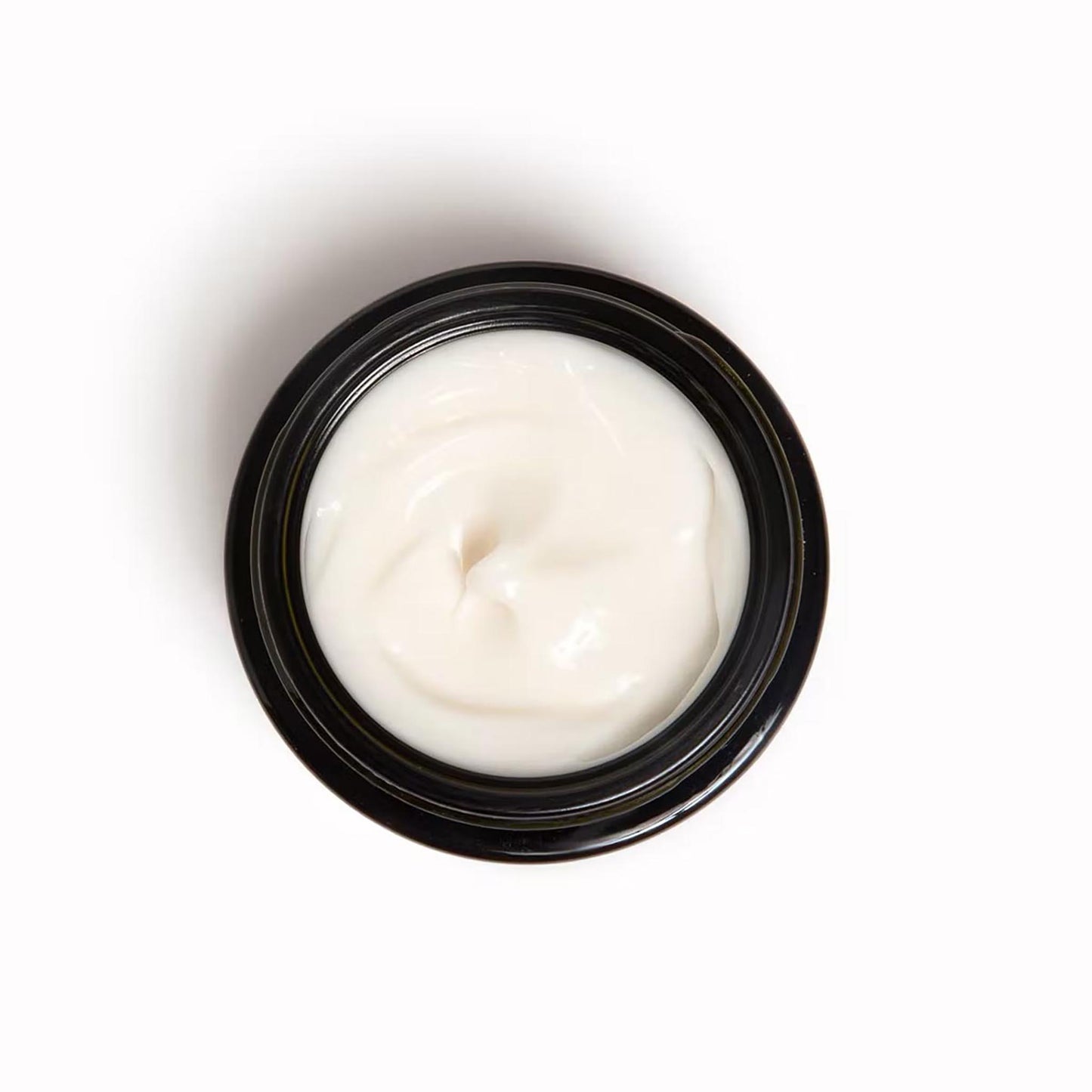 Draufsicht auf den geöffneten 50 ml Tiegel Baûbo Baume Canon Gorgeous Balm – Cremig-weiße Textur des Bio-Körperbalsams für die Pflege von Brust, Bauch und Po.